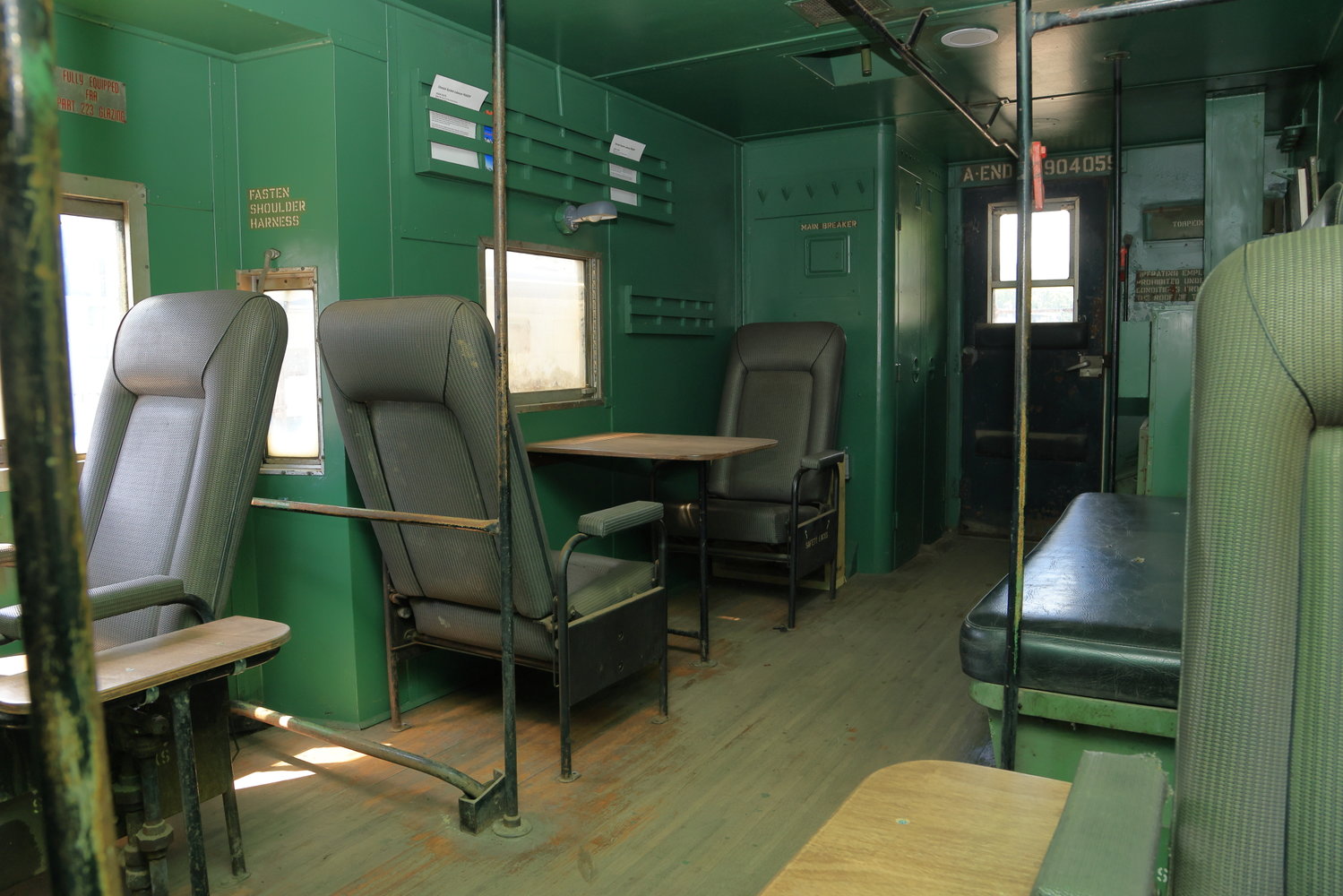 Inside Caboose No. 904059, showing seating and convertible bunk area.